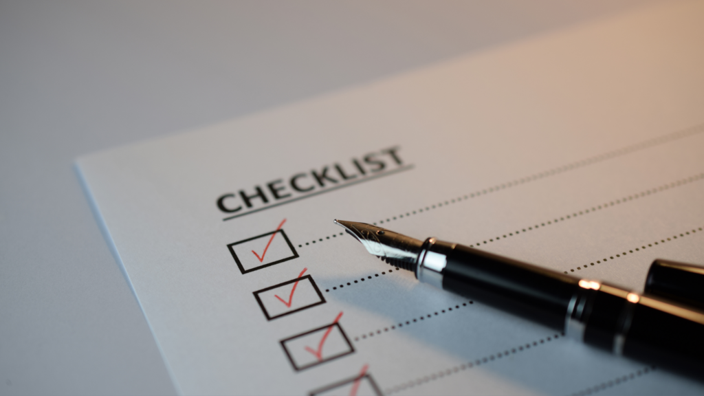 Checklist with checked items and pen